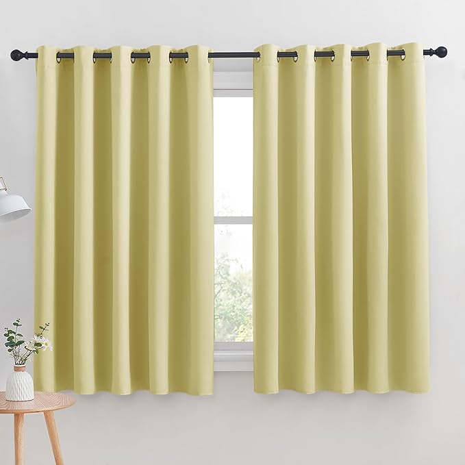 NICETOWN Thermal Insulated Paler Yellow Blackout Curtains for Bedroom, Set of 2, 70 by 63 inches Long, Window Treatment Solid Grommet Room Darkening Drape Panels for Bedroom