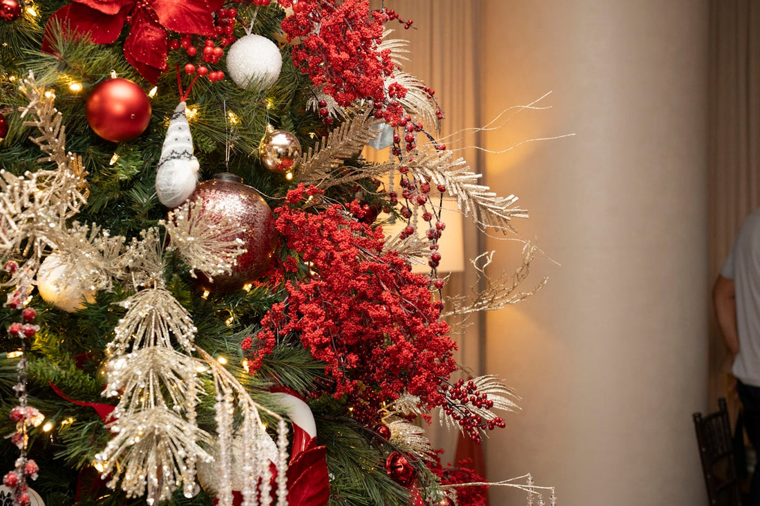 a decorated christmas tree with red and silver ornaments